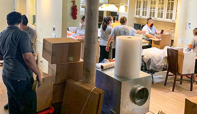 Restoration crew packing and processing items