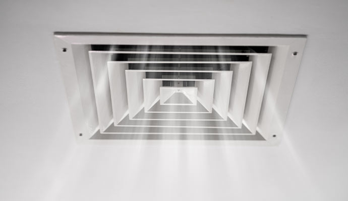 A ceiling mounted rectangular HVAC ceiling air diffuser