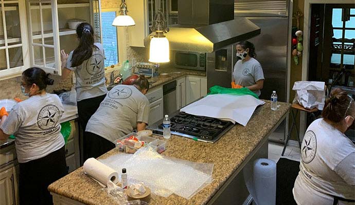 Fire reconstruction inc team packing kitchen contents