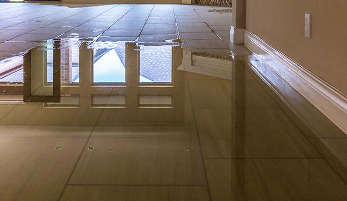Standing water covering a tile floor in a commercial space