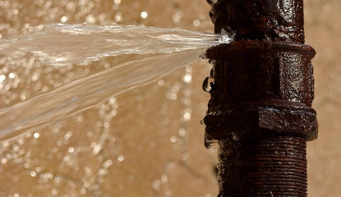 Water spraying out from a broken water pipe