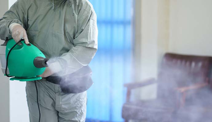 Technician using fogger for smoke odor removal