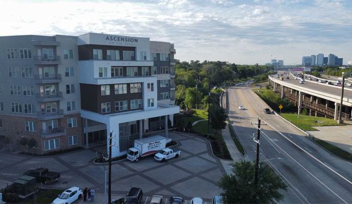 Fire reconstruction service vehicle in front of a commercial space