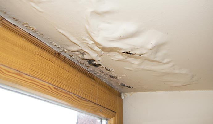 Water damaged ceiling due to roof leak