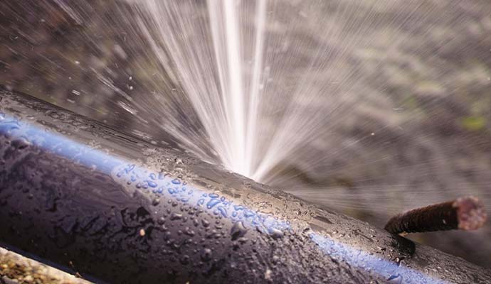 Water gushing from a burst pipe